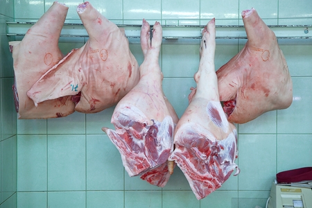 The meat Department at the market. Buyers and sellers in the market. Raw pork.の写真素材