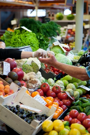 Fruit market with various colorful fresh fruits and vegetablesの写真素材