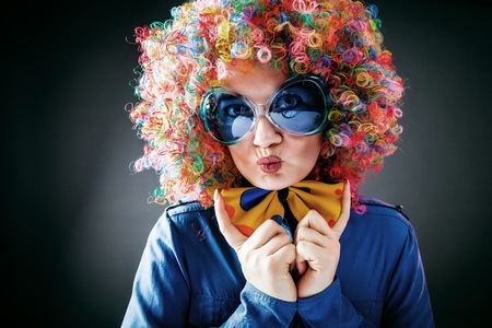 Portrait of beautiful party woman in wig and glasses Carnivalの写真素材