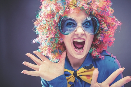 Portrait of beautiful party woman in wig and glasses Carnivalの写真素材