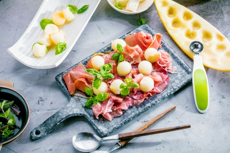 Concept of italian food with melon and prosciutto, selective focusの写真素材