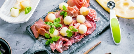 Concept of italian food with melon and prosciutto, selective focusの写真素材