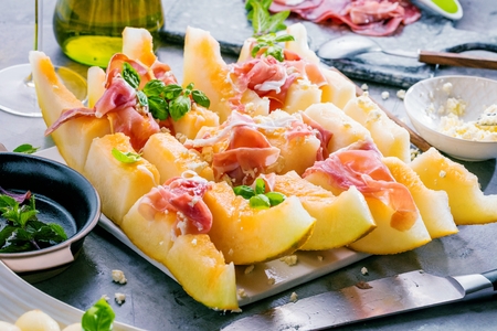Concept of italian food with melon and prosciutto, selective focusの写真素材