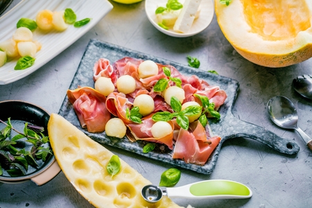 Concept of italian food with melon and prosciutto, selective focusの写真素材
