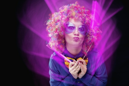 Portrait of beautiful party woman in wig and glasses Carnivalの写真素材
