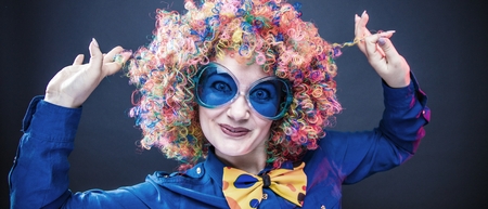 Portrait of beautiful party woman in wig and glasses Carnivalの写真素材