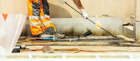 Workers on a road construction, industry and teamworkの写真素材