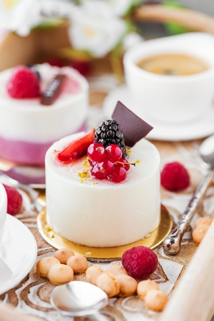 Sweet cakes with berries on table close-upの写真素材