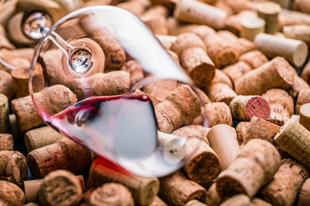 Wine corks background red wine glass and wine corksの写真素材