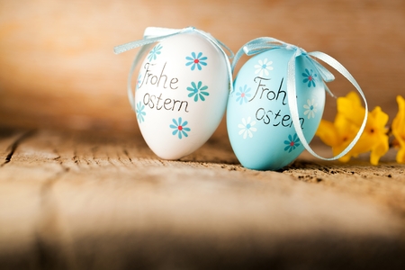 Easter decoration eggs cute bunny. Happy Easter. Vintage style toned picture Text in GErman HAPPY ESTERの写真素材