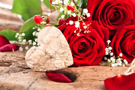 Roses and a hearts on wooden board, Valentines Day background, with German TEXT VALENTINS DAYの写真素材