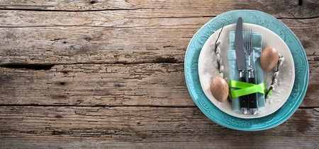 Easter table setting with spring flowers and cutlery. Holidays background..