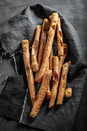 Grissini - traditional Italian salty breadsticks sprinkled with poppy seeds
