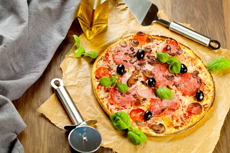 Tasty pizza on wooden table, top viewの写真素材