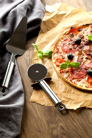 Tasty pizza on wooden table, top viewの写真素材