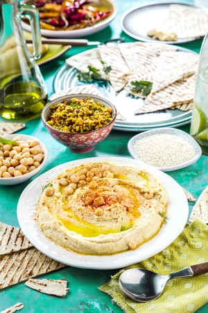 Healthy Homemade Creamy Hummus with Olive Oil and Pitaの写真素材