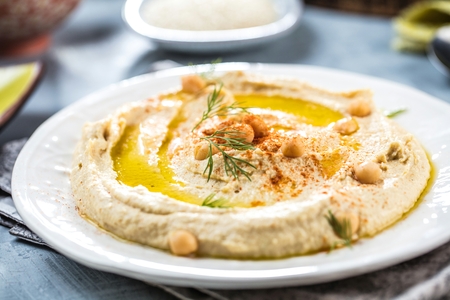 Healthy Homemade Creamy Hummus with Olive Oil and Pitaの写真素材