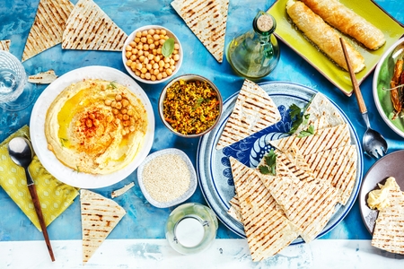 Healthy Homemade Creamy Hummus with Olive Oil and Pita