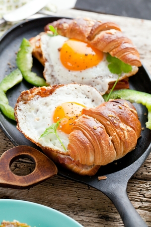 Delicious Breakfast with Croissant sandwiches with Fried Eggの写真素材