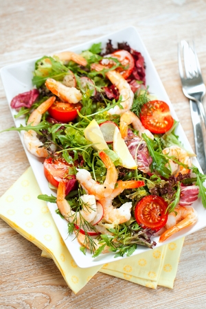 Prawn salad. Simple and healthy salad of shrimp, mixed greens and tomatoes.の写真素材
