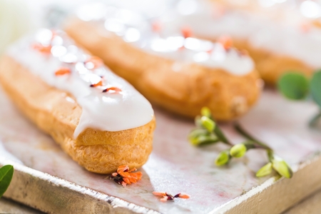 Home made cake eclairs. Traditional eclairs, profitroles classic, eclairs french.
