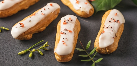 Home made cake eclairs. Traditional eclairs, profitroles classic, eclairs french.