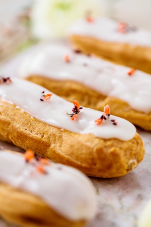 Home made cake eclairs. Traditional eclairs, profitroles classic, eclairs french.