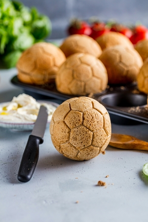Breakfast with cup of coffee german garland, bread in form of ball football.