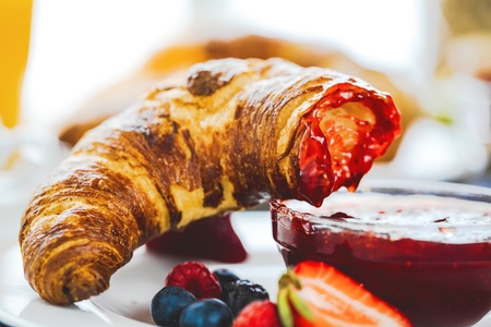 Breakfast served with coffee, orange juice, croissants, cereals and fruits. Balanced dietの写真素材