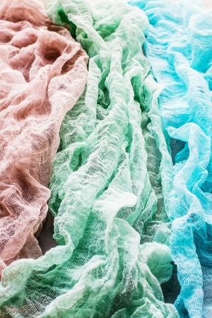 Grungy concrete wall and floor as background texture with piece of fabricの写真素材