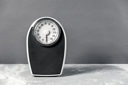 Bathroom scale isolated on grey background close upの写真素材