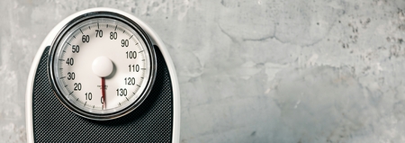 Bathroom scale isolated on grey background close upの写真素材