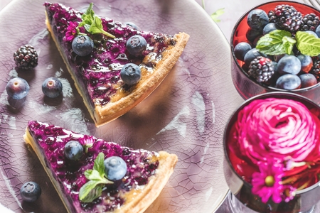 Sweet Cheese cakes with berries, mint and whipped cream. Top viewの写真素材