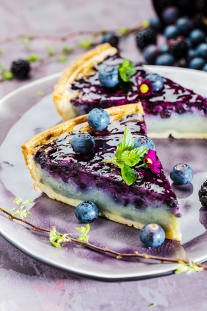 Sweet Cheese cakes with berries, mint and whipped cream. Top viewの写真素材