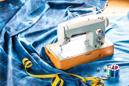 sewing indigo denim jeans with sewing machine, garment industrial conceptの写真素材