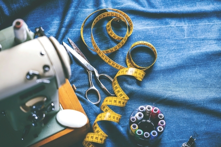 sewing indigo denim jeans with sewing machine, garment industrial conceptの写真素材