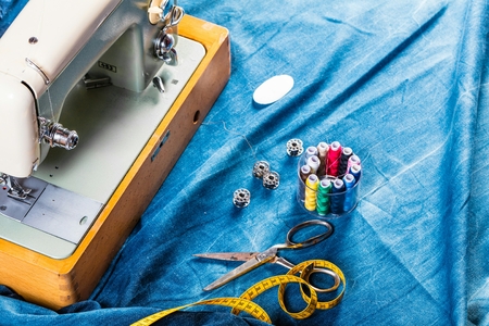 sewing indigo denim jeans with sewing machine, garment industrial conceptの写真素材