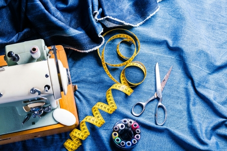 sewing indigo denim jeans with sewing machine, garment industrial conceptの写真素材
