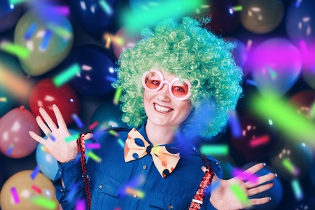 Portrait of beautiful party woman in wig and glasses Carnevalの写真素材