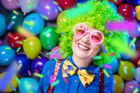 Portrait of beautiful party woman in wig and glasses Carnevalの写真素材