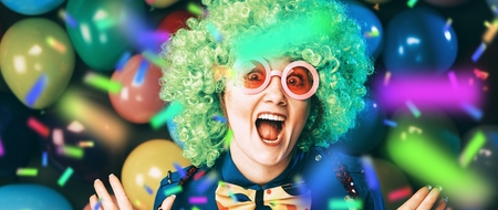 Portrait of beautiful party woman in wig and glasses Carnevalの写真素材