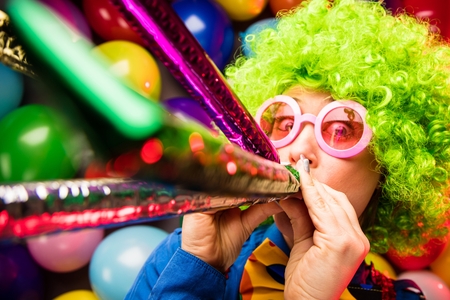 Portrait of beautiful party woman in wig and glasses Carnevalの写真素材