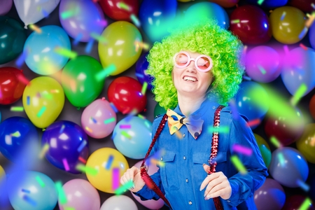 Portrait of beautiful party woman in wig and glasses Carnevalの写真素材