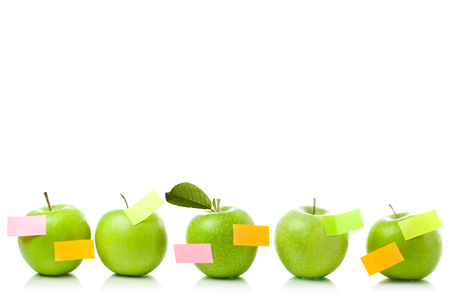 apple with empty note, designer could write any text on paperの写真素材