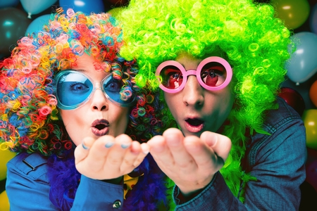 Women and men celebrating at party for new years eve or carnivalの写真素材