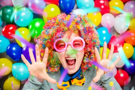 Portrait of beautiful party woman in wig and glasses Carnevalの写真素材