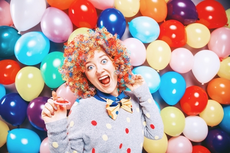 Portrait of beautiful party woman in wig and glasses Carnevalの写真素材