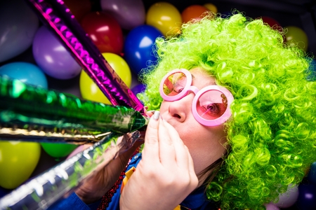 Portrait of beautiful party woman in wig and glasses Carnevalの写真素材