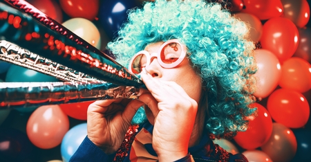 Portrait of beautiful party woman in wig and glasses Carnevalの写真素材