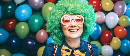 Portrait of beautiful party woman in wig and glasses Carnevalの写真素材